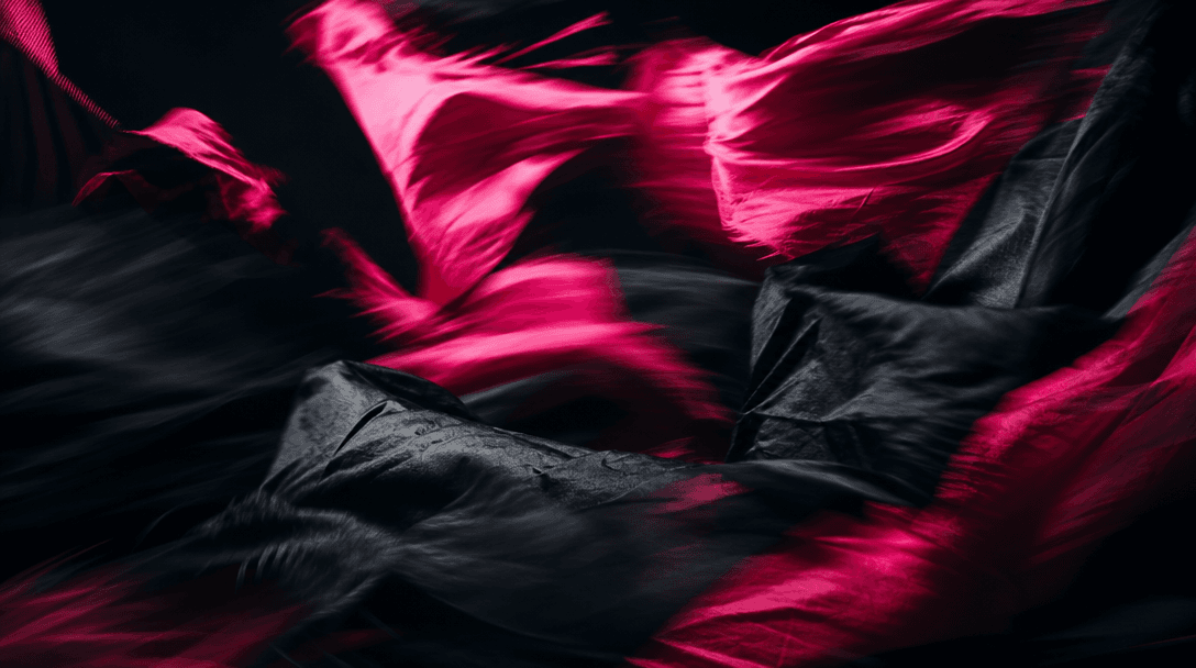 Abstract cinematic motion: deep black and hot pink fabric fragments blurring in dynamic movement against a near-black ba