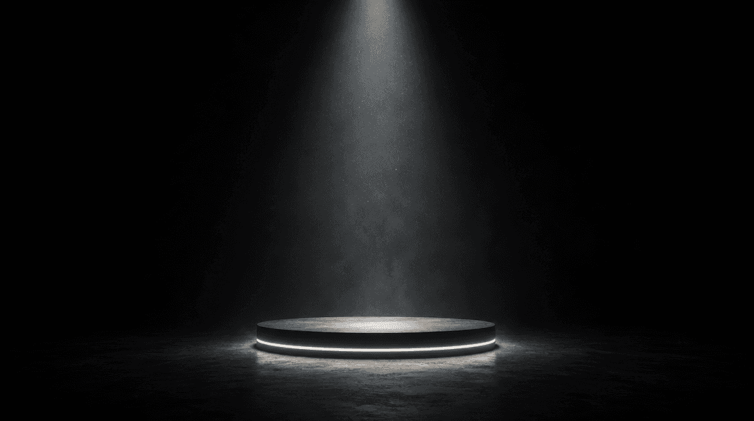 A minimalist product stage: a single backlit platform at the center of a vast dark space, dramatically spotlit from abov