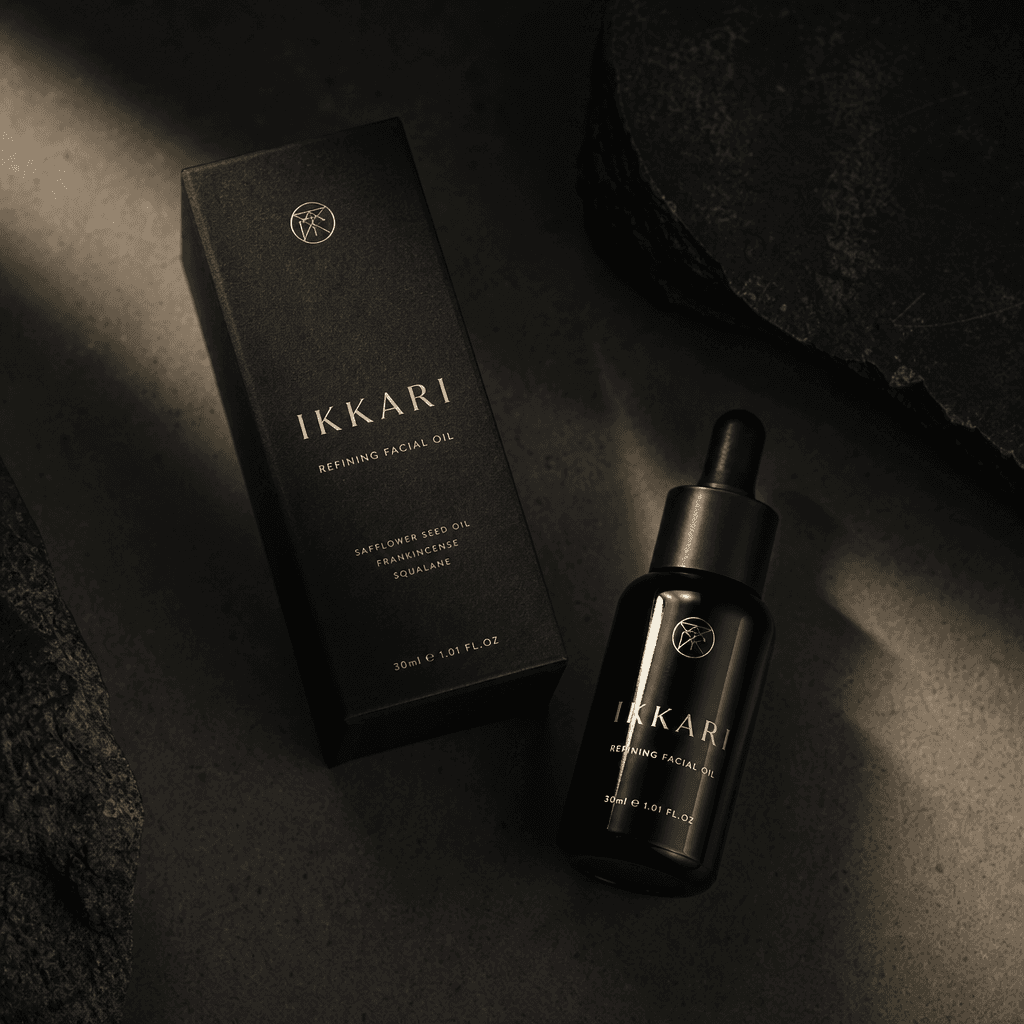 Skincare product in premium packaging, shot from above with artistic shadows and lighting. Dark editorial mood, minimali