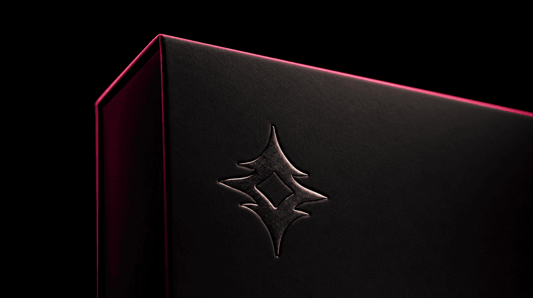 Cinematic close-up of a luxury product package — a matte dark box with clean sharp typography and a brand symbol — again