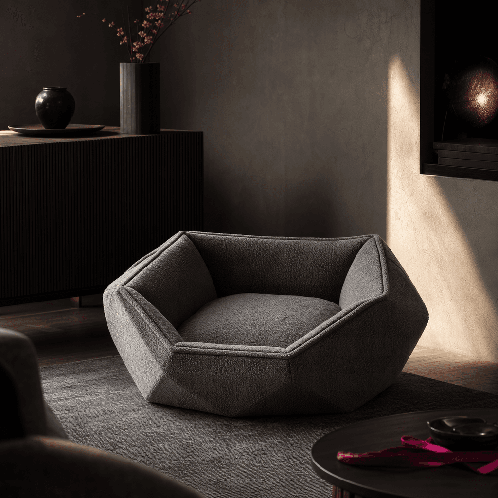A plush geometric pet bed staged in a refined contemporary interior with dark wood, textured plaster, and a narrow beam 