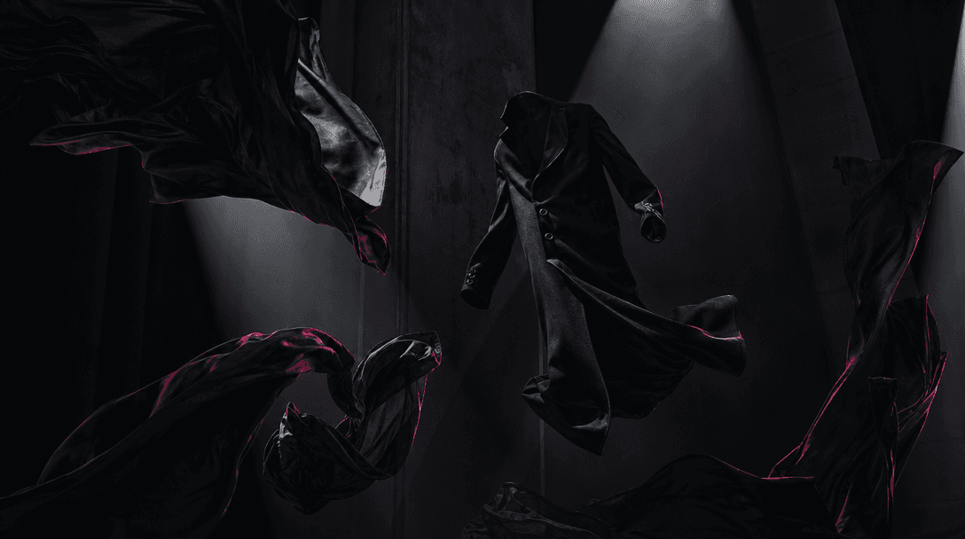 A black tailored coat and sheets of dark fabric floating weightlessly inside a tall shadowed studio, materials twisting 