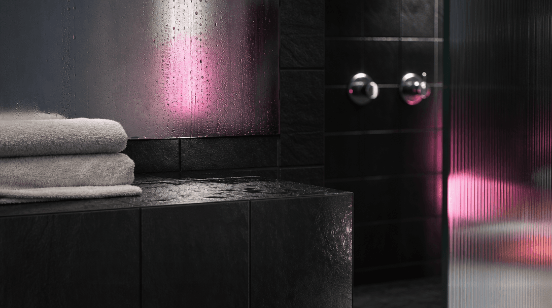 An abstract bathroom material landscape of black tile, fogged mirror, water droplets, brushed chrome, translucent glass,