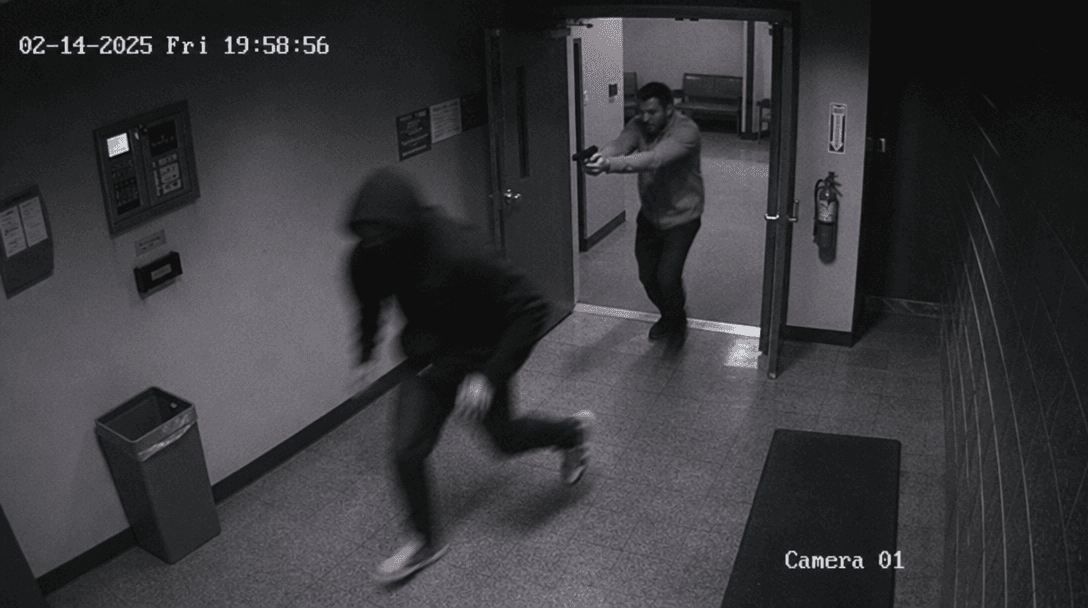 Dramatic unexpected moment captured in grainy CCTV style, dim security lighting with timestamp visible, authentic securi