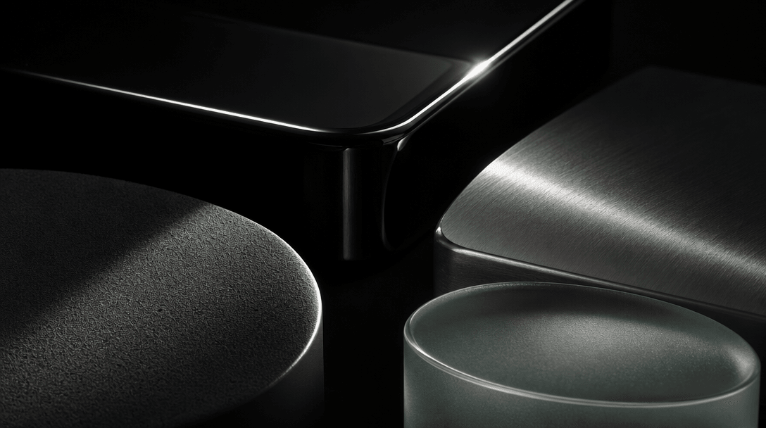 Abstract editorial study of contrasting product material surfaces — matte powder, high-gloss lacquer, brushed metal, fro