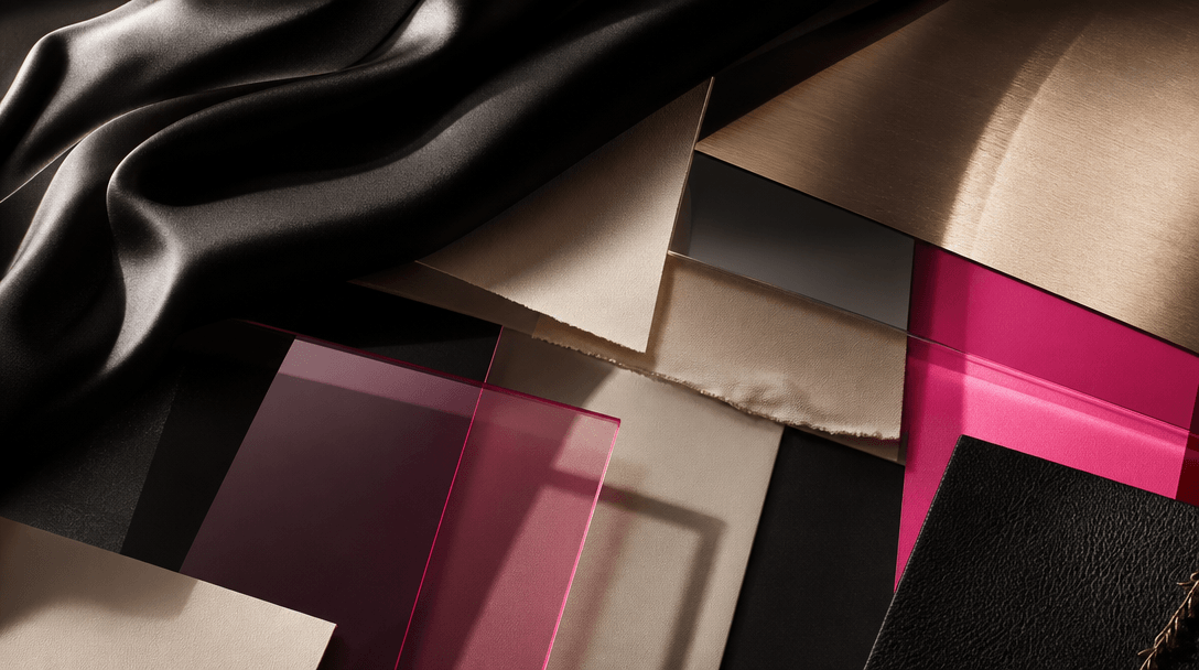 Abstract fashion mood study built from layered silk, brushed metal, translucent acetate, leather, and colored paper in a