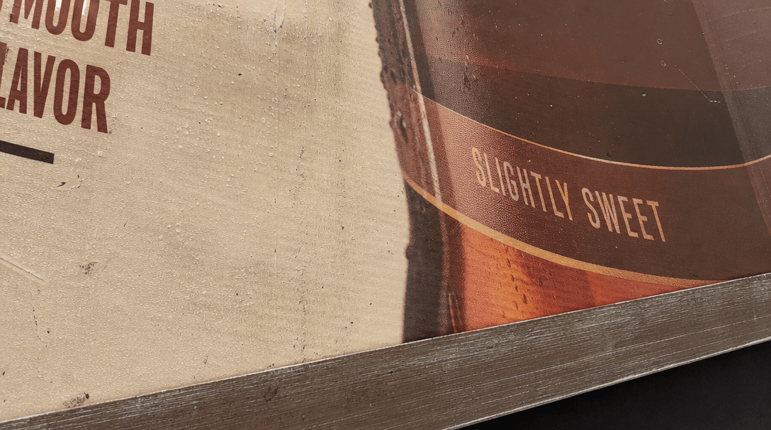 Close-up detail of photorealistic billboard surface showing product packaging texture, realistic material reflection and