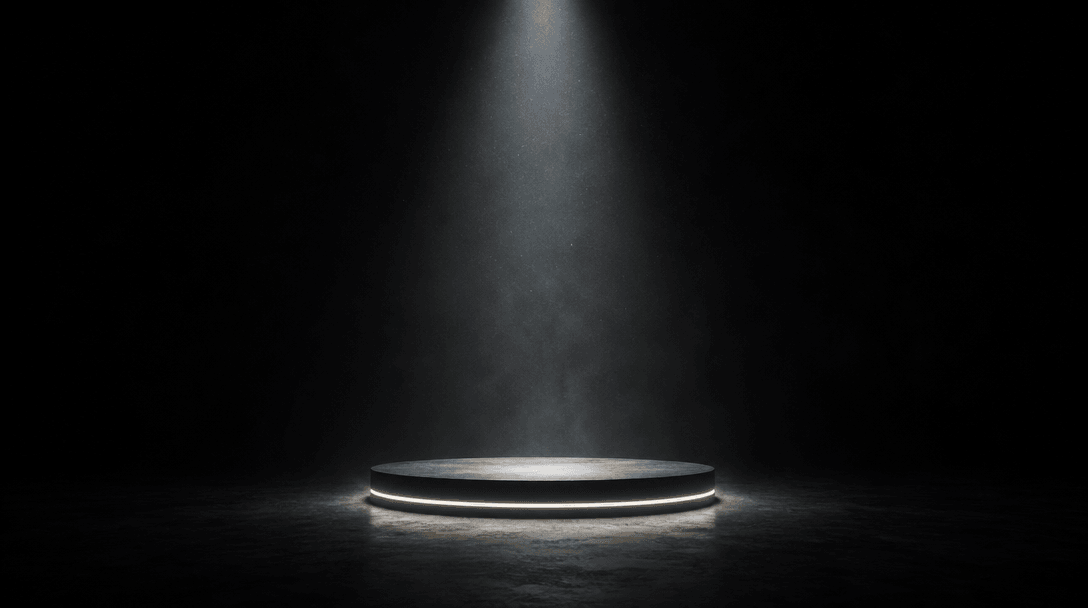A minimalist product stage: a single backlit platform at the center of a vast dark space, dramatically spotlit from abov