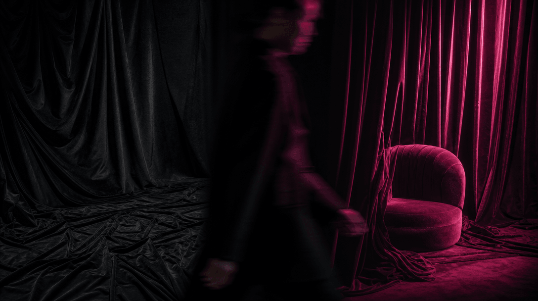 A blurred human silhouette sweeping laterally across a sharply lit fashion set, creating a natural dark wipe between two