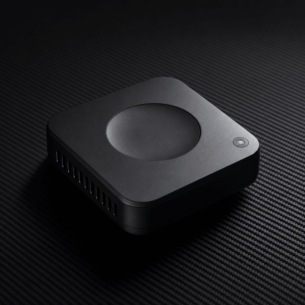 Minimalist product hero shot, sleek matte black tech device on dark textured carbon surface, dramatic raking side studio