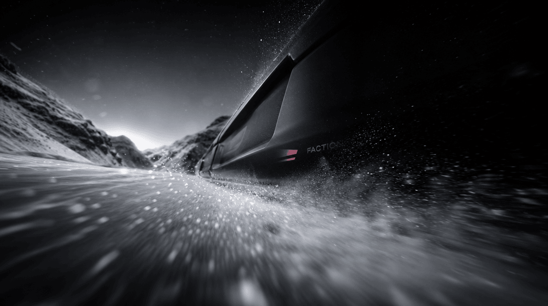 A low cinematic viewpoint racing inches above fresh snow, powder streaking past the lens as sculpted black product mater