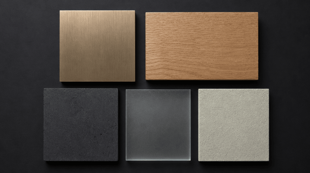 Flat-lay studio macro of five architectural material sample tiles arranged precisely on a matte black surface — brushed 