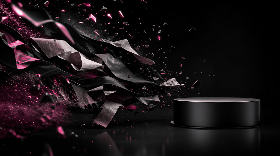 A dramatic wave of paper, fabric, polished fragments, and fine particles moving across a black studio environment toward