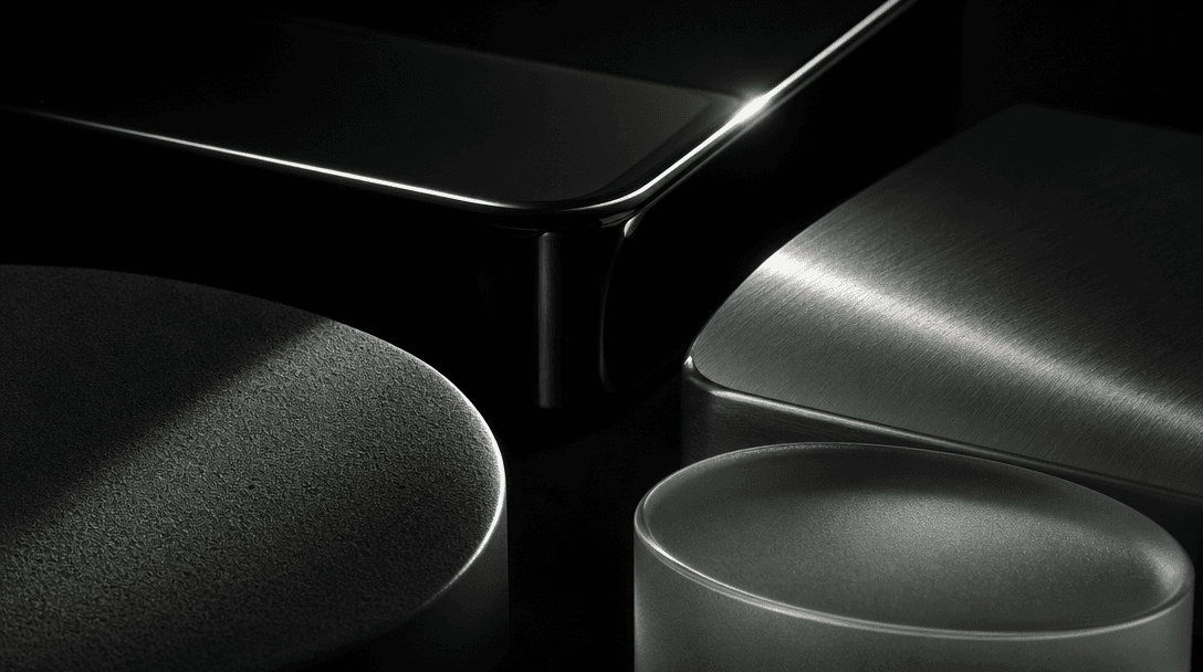 Abstract editorial study of contrasting product material surfaces — matte powder, high-gloss lacquer, brushed metal, fro