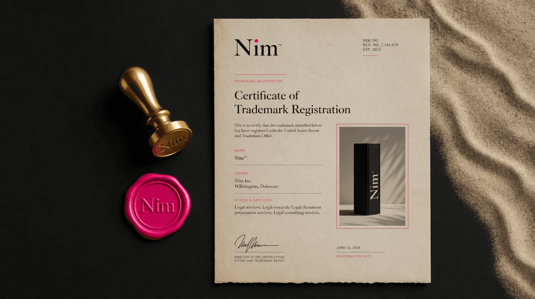 Minimalist flat lay composition: gold wax seal stamp, legal parchment document with Nim branding in corner, product phot