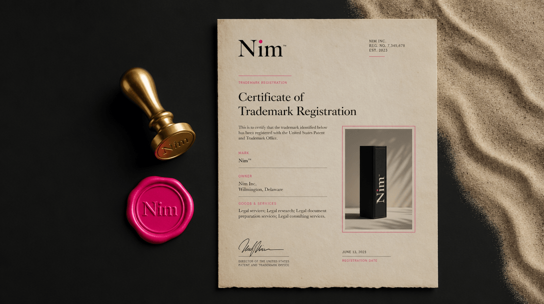 Minimalist flat lay composition: gold wax seal stamp, legal parchment document with Nim branding in corner, product phot