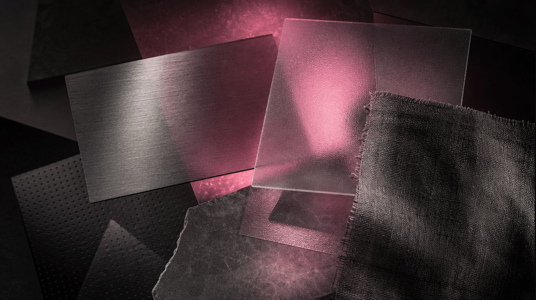 Multiple overlapping translucent material swatches — brushed metal, frosted glass, textured fabric — layered in a dark e