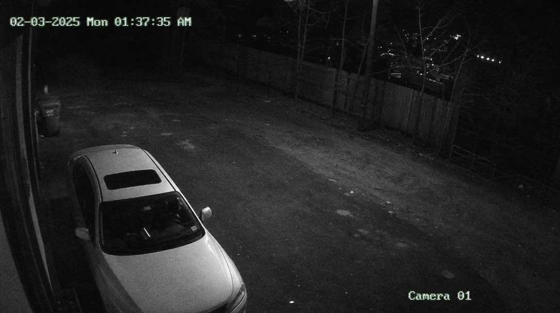CCTV surveillance footage with glowing timestamp overlay, grainy authentic texture, minimal security lighting, fixed cam