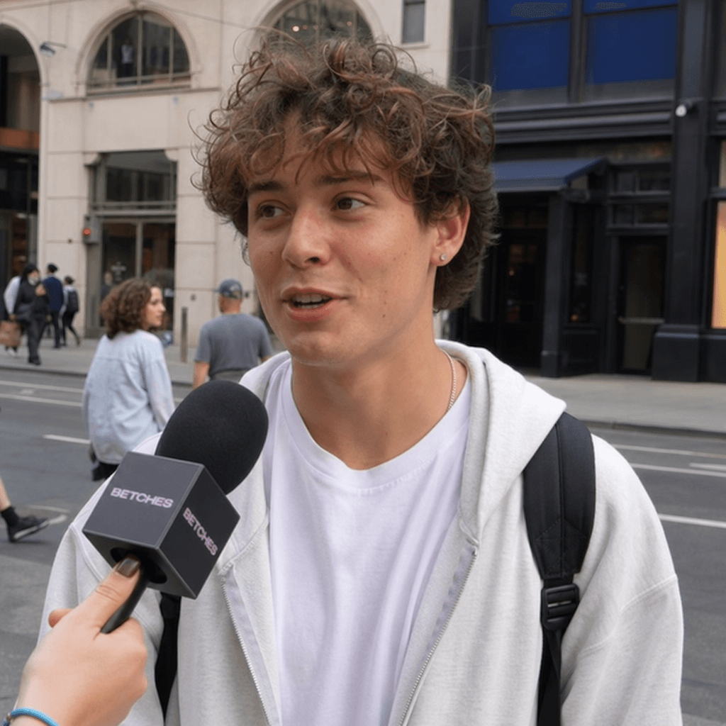 Street interview scene: close-up of person answering question with authentic expression, outdoor urban setting, natural