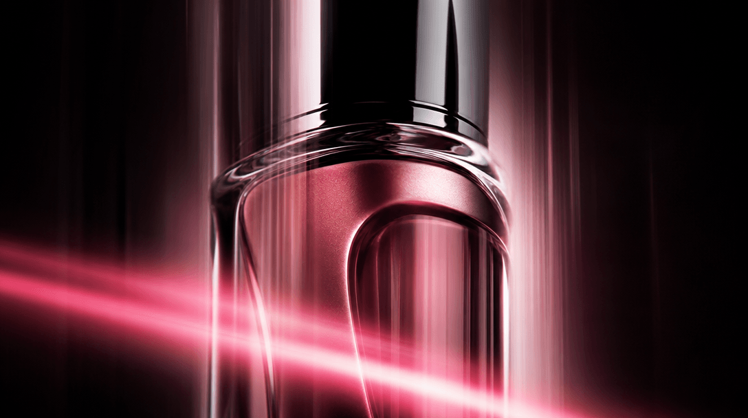 Extreme close-up of a cosmetic product bottle with soft vertical motion blur trails suggesting fluid descent, cinematic