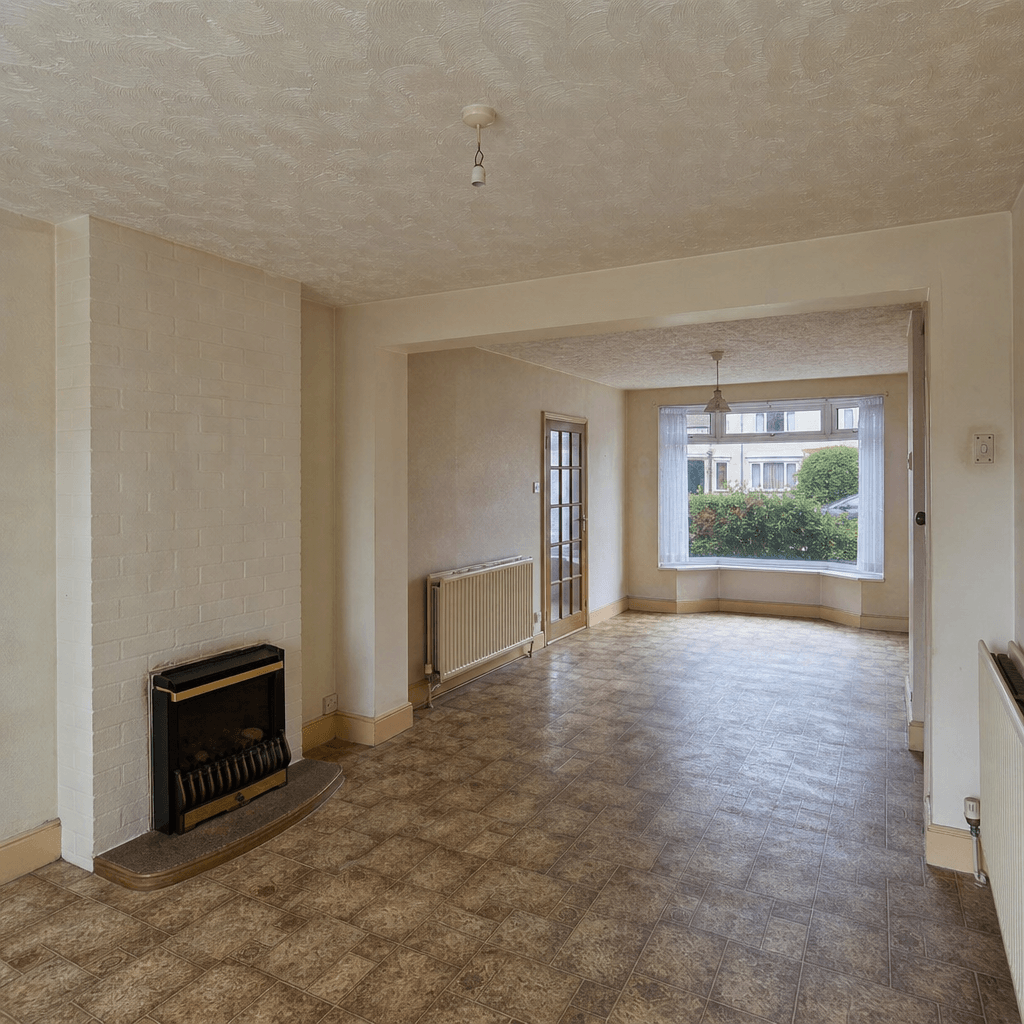 Realistic before-state open-plan living and dining room — original Artex plaster ceiling, period skirting boards, patter