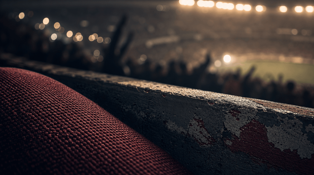 Abstract stadium atmosphere: close-up of stadium seat fabric weave and painted concrete texture, warm floodlight bokeh d
