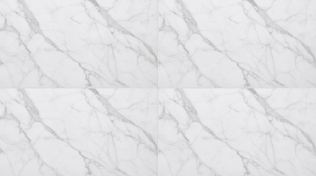 Abstract overhead flat-lay of a grid of four identical white marble tile surfaces, each lit identically with consistent