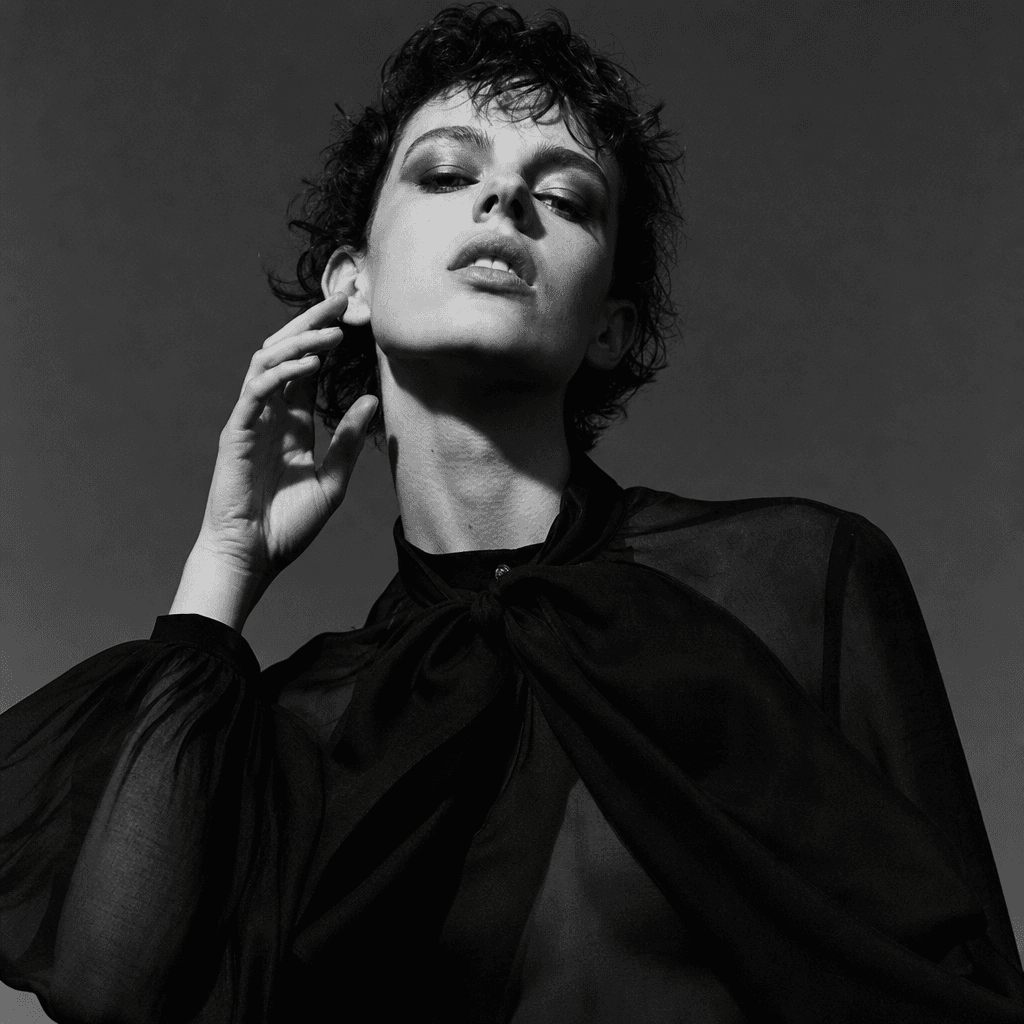 Fashion editorial monochrome portrait, high contrast, dramatic lighting, magazine quality, black-and-white fashion photo