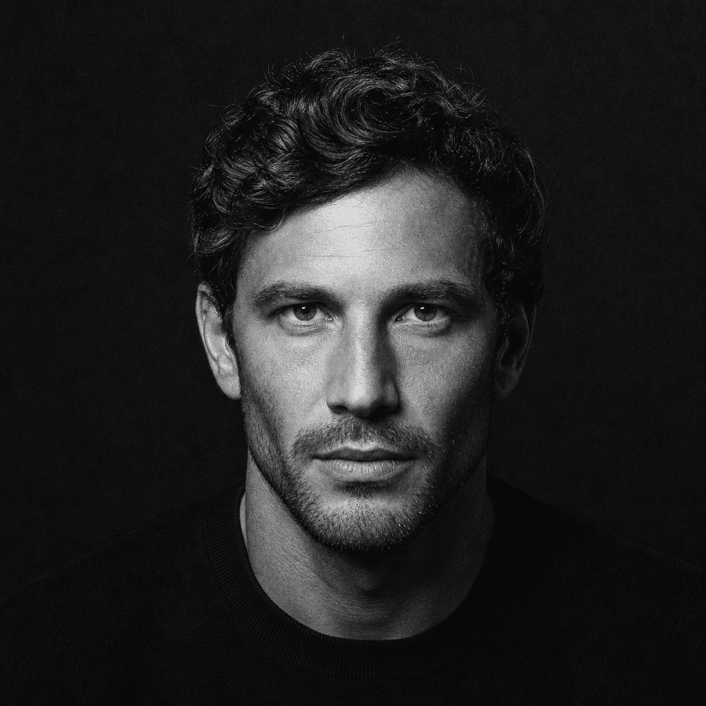 Square monochrome studio portrait of an anonymous adult man wearing a simple black crewneck, dramatic overhead softbox c