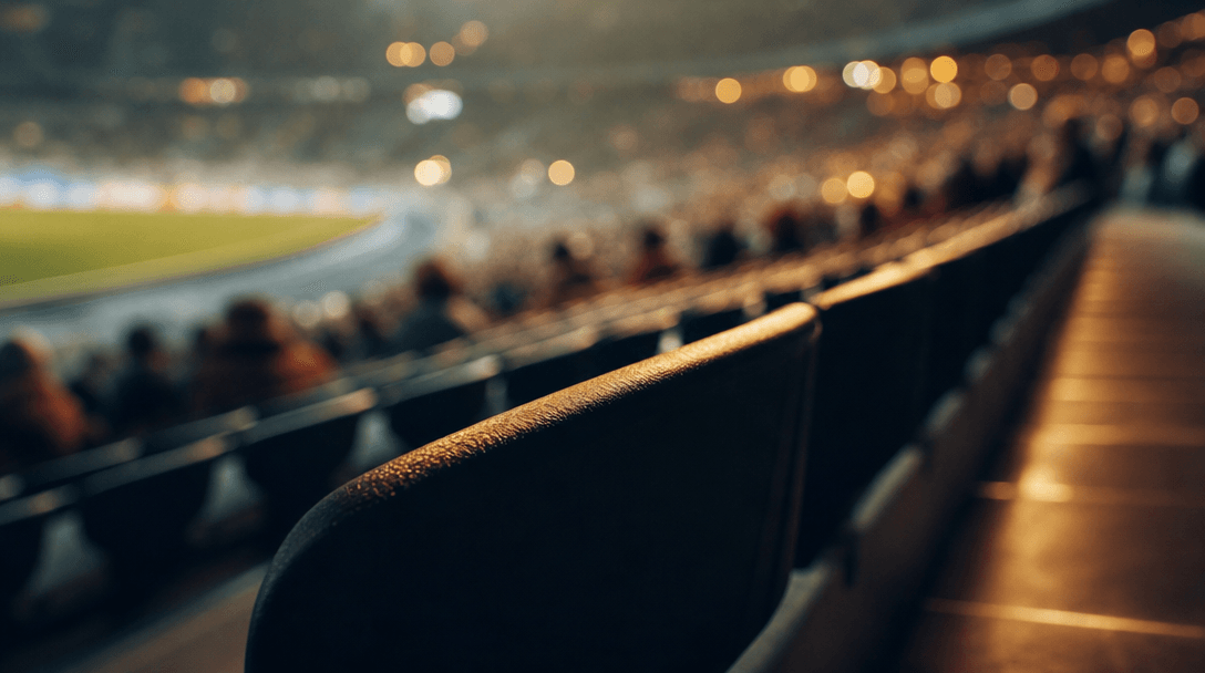 Perspective study of stadium tribune rows seen from a seated viewpoint, extreme shallow depth of field on nearest seat e