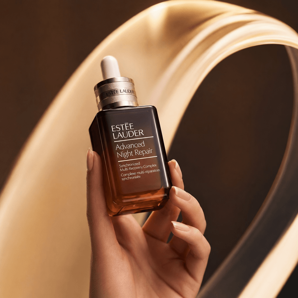 High-end beauty serum bottle backhold placement, professional product styling, dramatic lighting, magazine quality edito