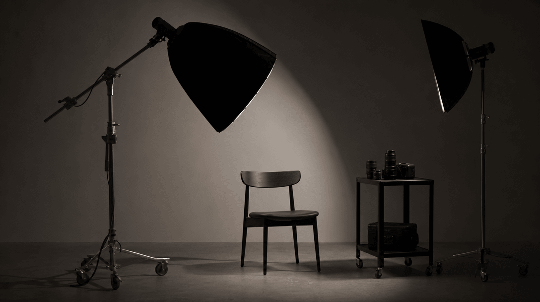 Minimalist studio environment with professional lighting setup - soft directional light creating clean shadows on neutra